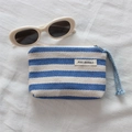 Macro detail of blue and white striped canvas coin purse with zipper and lanyard - Blue Stripe