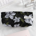 Detail of canvas makeup bag with floral embroidery, shown with lipstick and perfume - Oil Painting Black Grey Flower