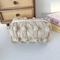 Detail of beige quilted bubble fabric pouch showing soft texture and zip closure - 3D Bubble Check Khaki