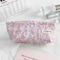 Detail of floral embroidery on pink canvas pouch with silver metal zipper closure - Pink and Blue Floral