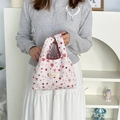 Detail of white bubble crinkled fabric tote bag featuring cute red strawberry embroidery - Pink Rabbit (White Crinkled)