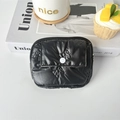 Close-up of black quilted PU coin purse with bow patterns and white snap button detail - PU Bow Black