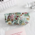 Detail of floral embroidery on canvas makeup bag with premium metal zipper closure - Green Pastoral