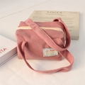 Detail of pink corduroy tote bag with Love Magnet patch and smooth cream zipper - Lotus Pink Corduroy