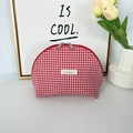 Detail of red and white checkered shell cosmetic bag with double zipper and woven label - Red Plaid
