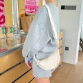 Detail of adjustable strap and water-resistant nylon texture on cream dumpling bag - Off-white