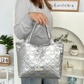 Detail of silver metallic tote bag with 3D heart quilting and branded tag - Heart Silver
