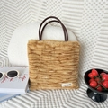 Detail of plush faux fur tote bag with brown tiger print and soft tubular handles - Plush Tiger Print