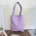 Detailed view of heavy canvas fabric texture on a plain purple shoulder tote bag - Purple (8oz)