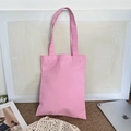Detailed view of pink canvas tote bag showing thick fabric texture and long shoulder straps - Pink (8oz)