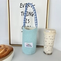 Detail of light blue fuzzy water bottle bag with rabbit patch and checkered handle - Light Blue