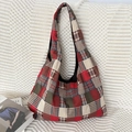 Detailed view of red and beige checkered canvas fabric texture on a large hobo tote bag - Red Grid