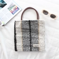 Detail of plush striped tote bag with leather handles and textured faux shearling fabric - Grey Black Striped
