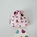 Detailed view of pink bubble texture fabric on a cute cartoon drawstring pouch - Bear with Red Hat on Pink Base