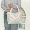 Close-up of pearl white quilted tote bag with bow embroidery and mayrabbit label - Solid Bow Decor Beige