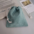 Detail of corduroy drawstring bag showing gray-green fabric texture and cotton rope - Grass Green