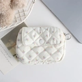 Close-up of floral quilted organizer bag with flip cover and metal hanging hook detail - White Base Floral