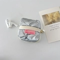 Detailed macro view of silver quilted earphone case with a pearl zipper pendant - Silver Bubble Rhombic
