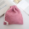 Detailed texture of rose pink corduroy drawstring storage bag with white cotton ropes - Lotus Pink