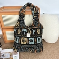 Close-up of plush tote bag with tribal tree pattern on a cozy woven rug background - Plush Maple Leaf Plaid