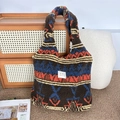 Detailed view of bohemian style plush tote bag featuring colorful geometric patterns - Plush Vintage Figure