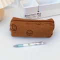 Close-up of caramel brown corduroy pencil case with a black embroidered smiley face detail - Brown Smile