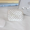 Close-up of heart-quilted earphone pouch with polka dots and metal ring zipper pull - Polka Dot Heart