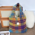 Detail of soft plush checkered tote bag with colorful pattern and brand label - Plush Colorful Grid