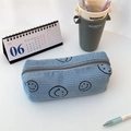 Close-up of light blue corduroy pencil case with smiley face embroidery and zip closure - Light Blue Gray Smiley Face