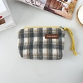 Detail of plaid coin purse with yellow zipper and brown leather label on canvas fabric - Woolen Light Gray Beige Plaid