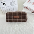 Detail of vintage brown plaid wool pencil case with premium leather brand label - Woolen Brown Plaid