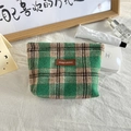 Detail of plaid makeup bag with premium fabric texture and stylish leather logo tag - Woolen Emerald Green Plaid