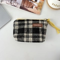 Detail of checkered canvas coin purse with yellow zipper and brand leather patch - Woolen Black White Plaid