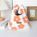 Detail of soft white plush handbag featuring orange flower patterns and plaid fabric lining - Plush Orange Flower
