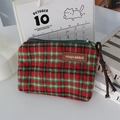 Close-up of red and green plaid tweed coin purse with metal zipper and leather logo - Woolen Red Plaid