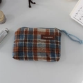 Detail view of Scottish plaid coin purse featuring a leather logo tag and blue woven zipper pull - Woolen Blue Plaid