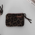Detail of leopard print plush coin purse with leather label and woven rope zipper pull - Suede Large Leopard Print