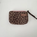Detail view of leopard print canvas coin purse with pink zipper and wrist strap - Suede Small Leopard Print