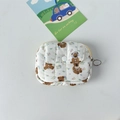 Close-up of quilted floral card holder featuring cute bear patterns and metal zipper detail - Cartoon Bear