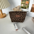 Detailed close-up of retro leopard print suede makeup bag with branded leather patch - Suede Small Leopard Lipstick Bag