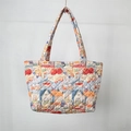 Detail of quilted tote bag featuring colorful rabbit prints and secure metal clasp - Rabbit Family