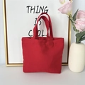 Detail shot of the red canvas tote bag showing the thick fabric texture and handles - 8oz - Open Style / Red