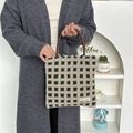 Detail of checkered plush tote bag featuring soft fleece texture and round handles - Plush Waffle Dark Green Grid