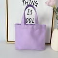 Detail view of a light purple canvas handbag showing durable fabric and soft texture - 8oz - Open Style / Purple