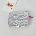 Detail of silver heart-quilted PU leather coin purse with zipper and pink puller - Large Heart Silver