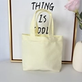 Minimalist canvas handbag in light yellow displayed as a stylish lunch tote - 8oz - Open Style / Beige