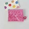 Macro detail of pink quilted heart texture on glossy mini coin purse with snap closure - Large Heart Deep Pink