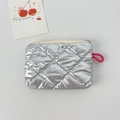 Macro detail of silver quilted PU leather pouch with zipper and pink lanyard - Bubble Rhombus Silver