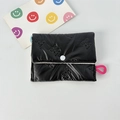 Detail of black quilted mini coin purse with embossed bow patterns and pink loop - Small Bowknot Black