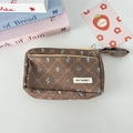 Detail of corduroy pencil case with blue floral pattern, diamond mesh, and handle - Brown Corduroy Quilted Flower